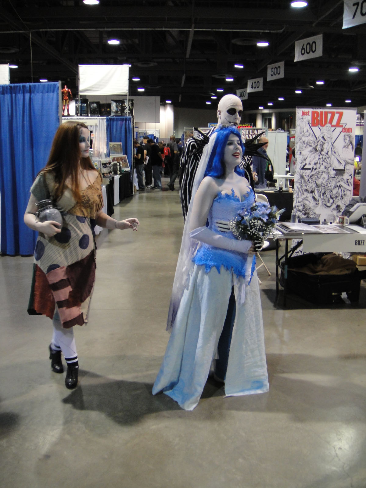 a couple of women in costume talking to each other