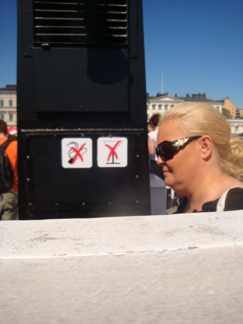 a woman with sunglasses is looking at soing in the distance