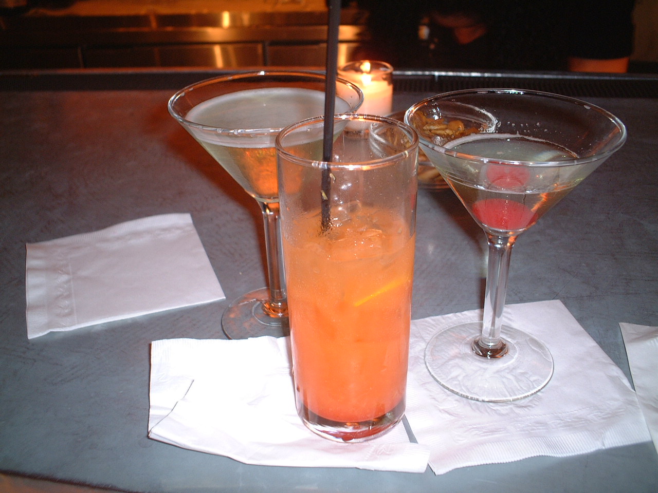 drinks in wine glasses on a table top