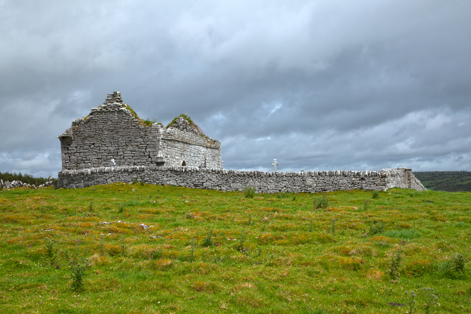 a stone castle sits high up in the sky