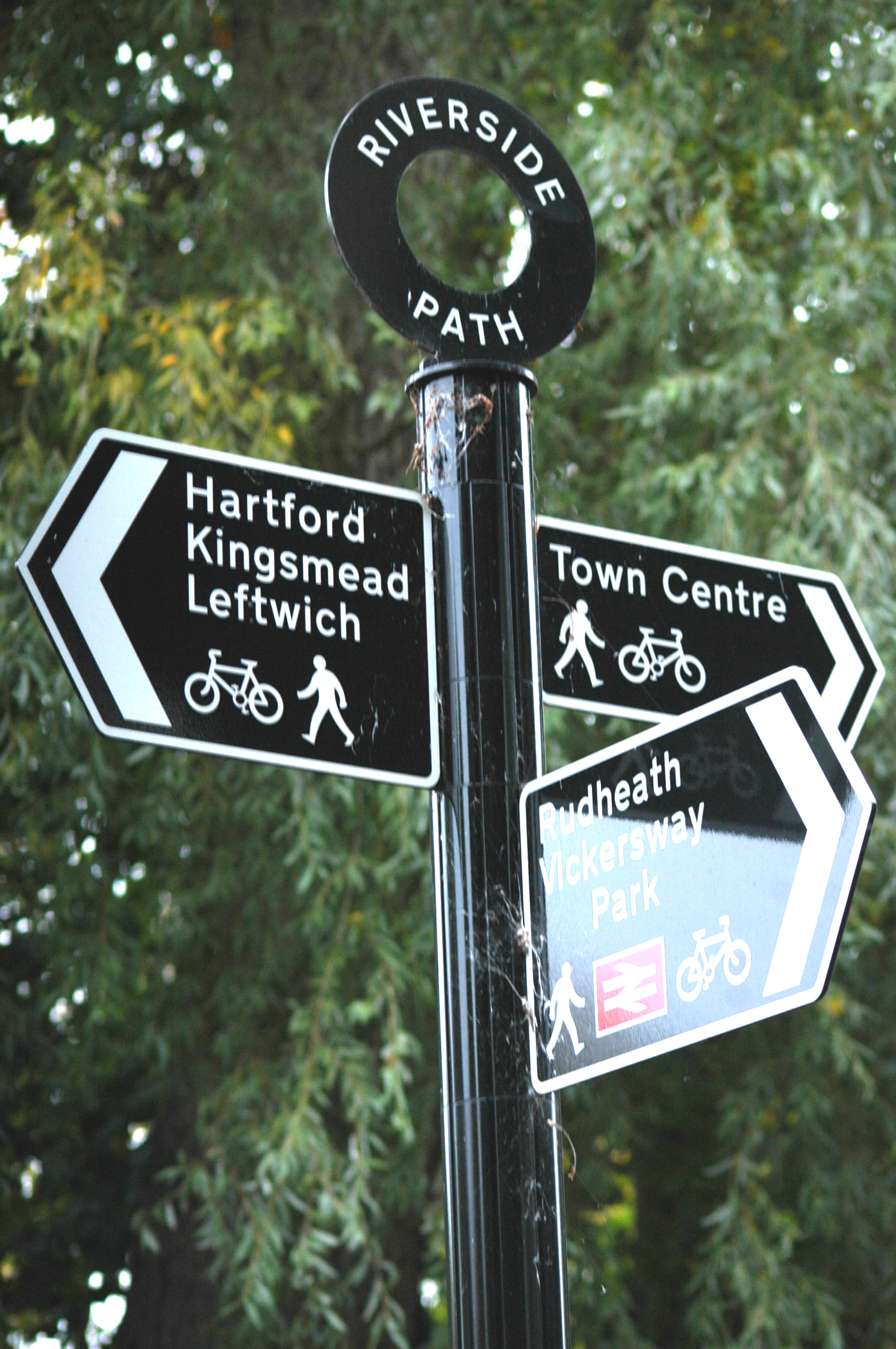 black and white street signs for bike path