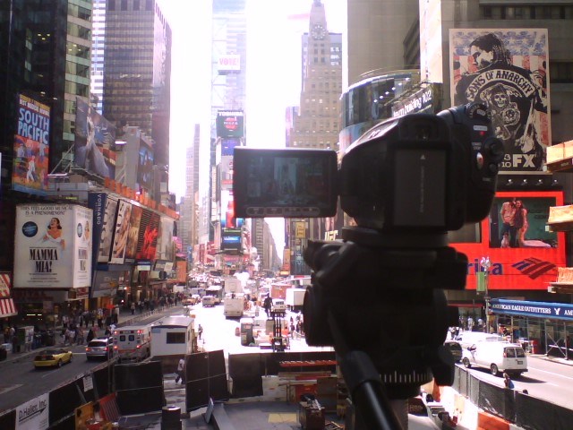 a camera being used for filming a city scene