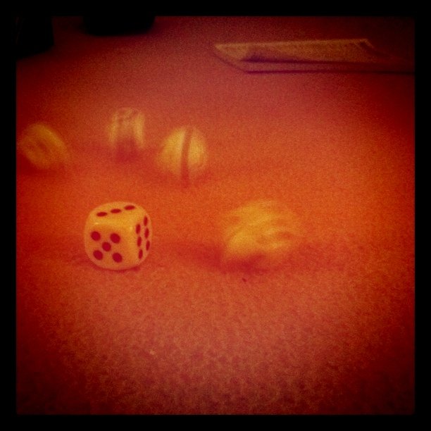 an upside down dice is on the floor