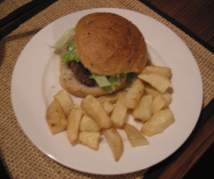 a hamburger and fries on a plate