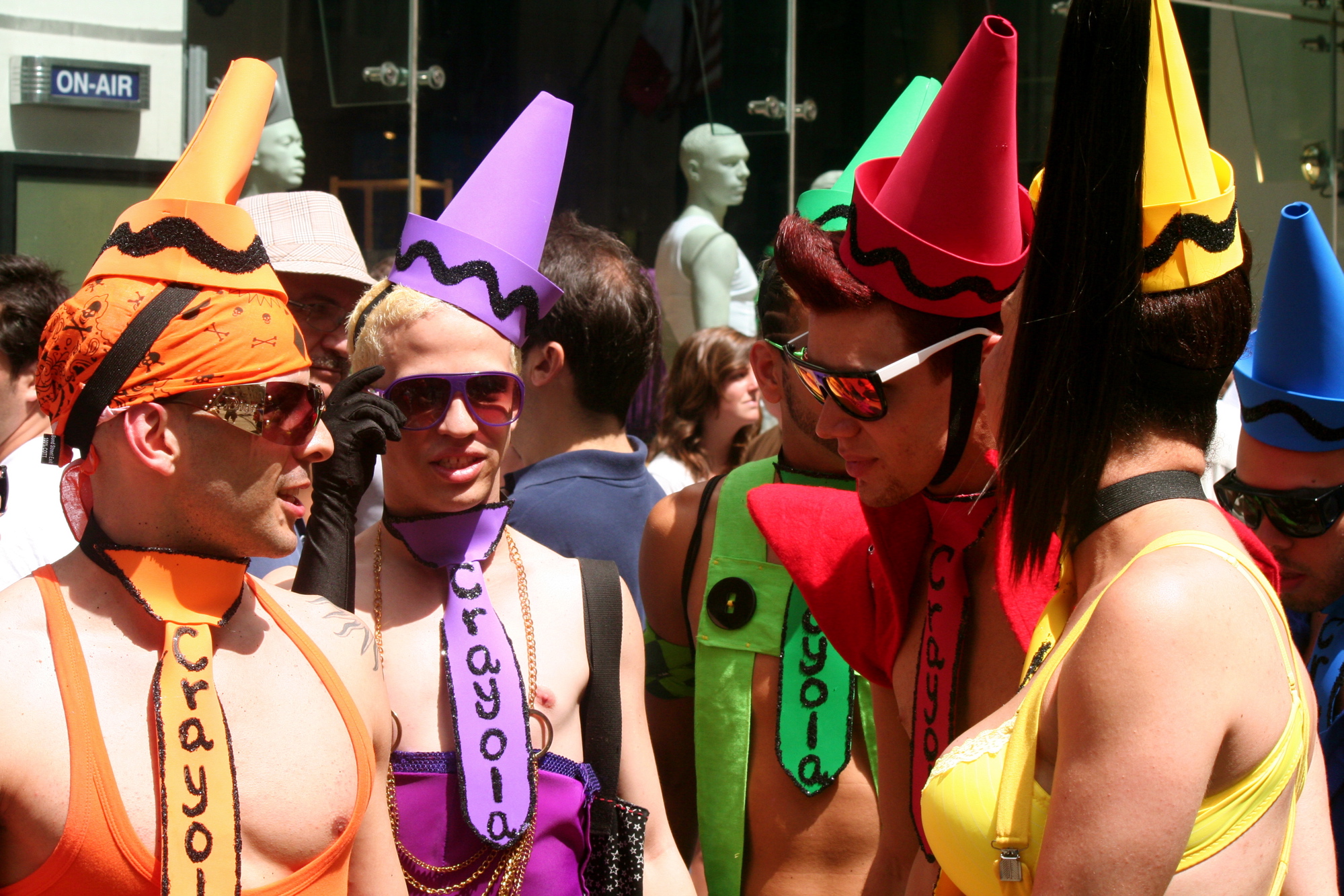 several people wearing hats and costumes at a parade