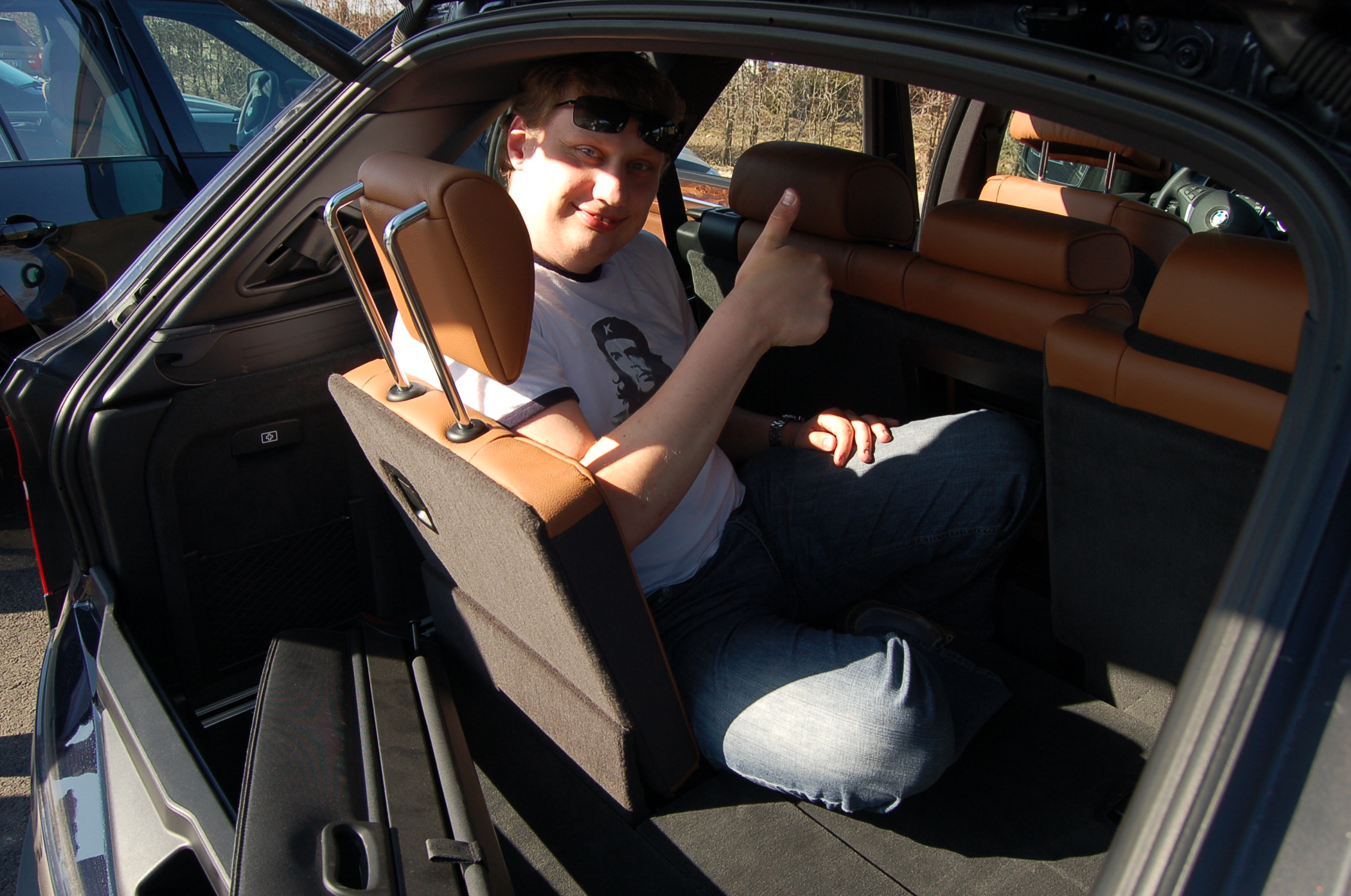 a person sitting in the passenger seat of a car