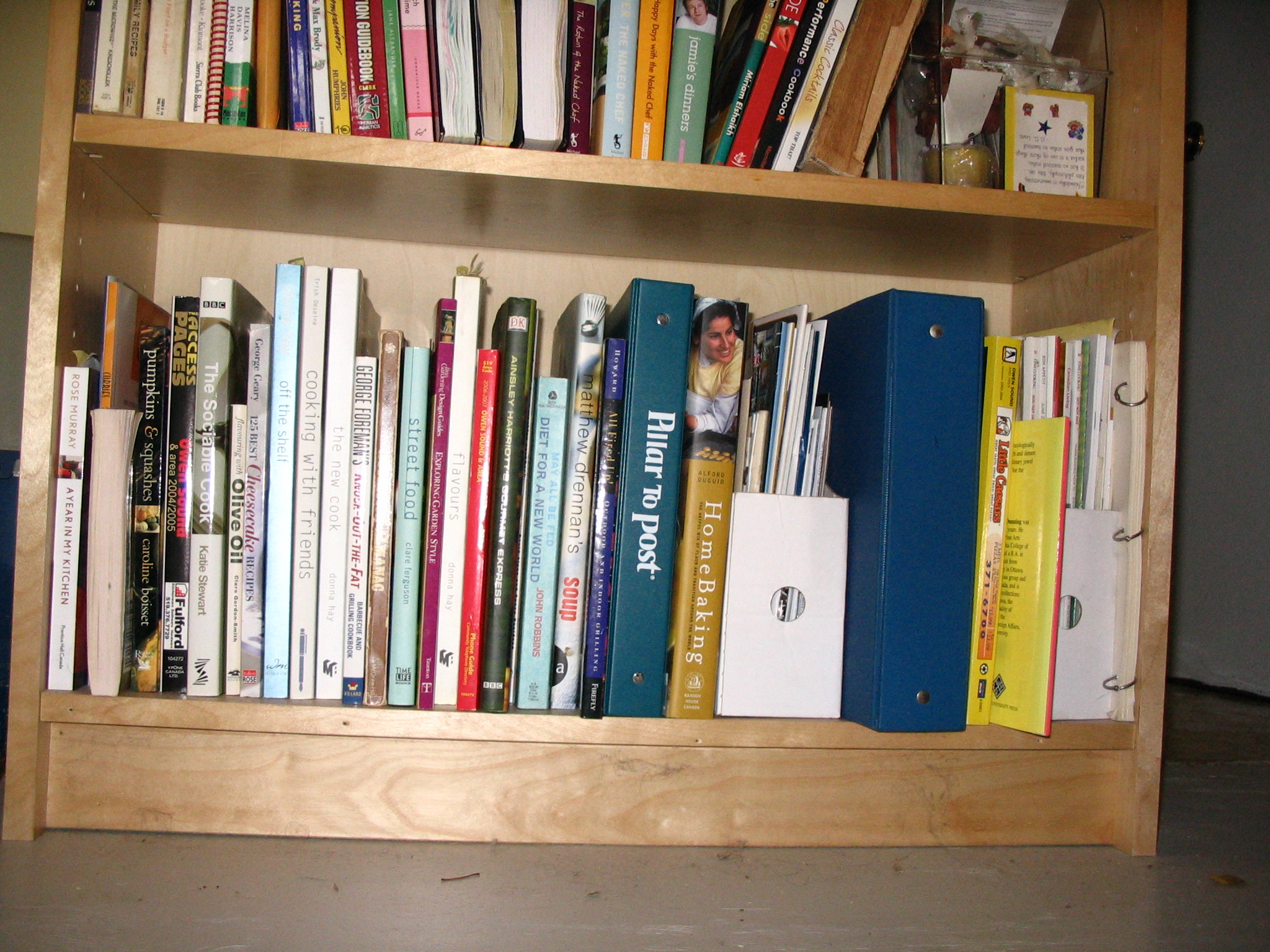 several books on the shelves in a home liry