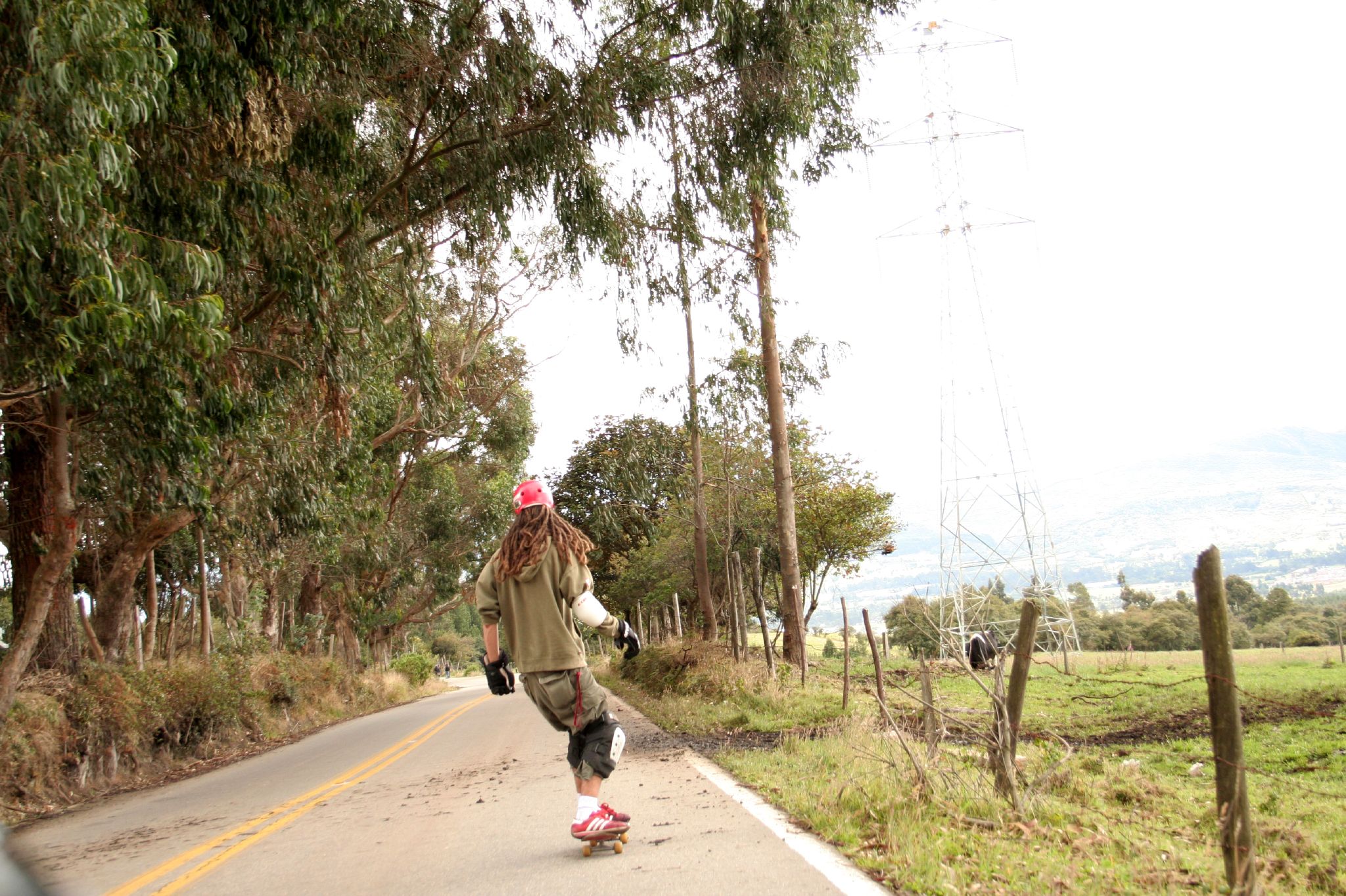 woman is riding a skateboard on a street