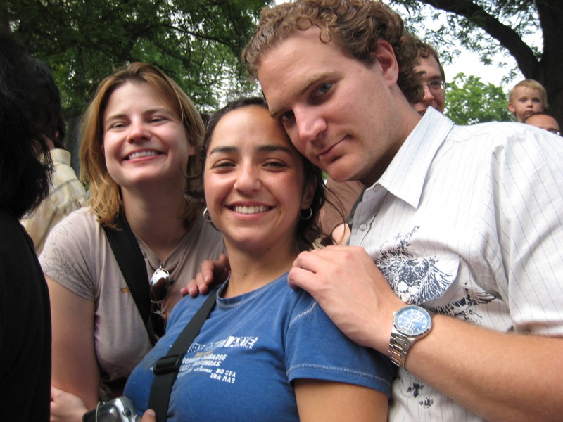 three people are posing for the camera for a picture
