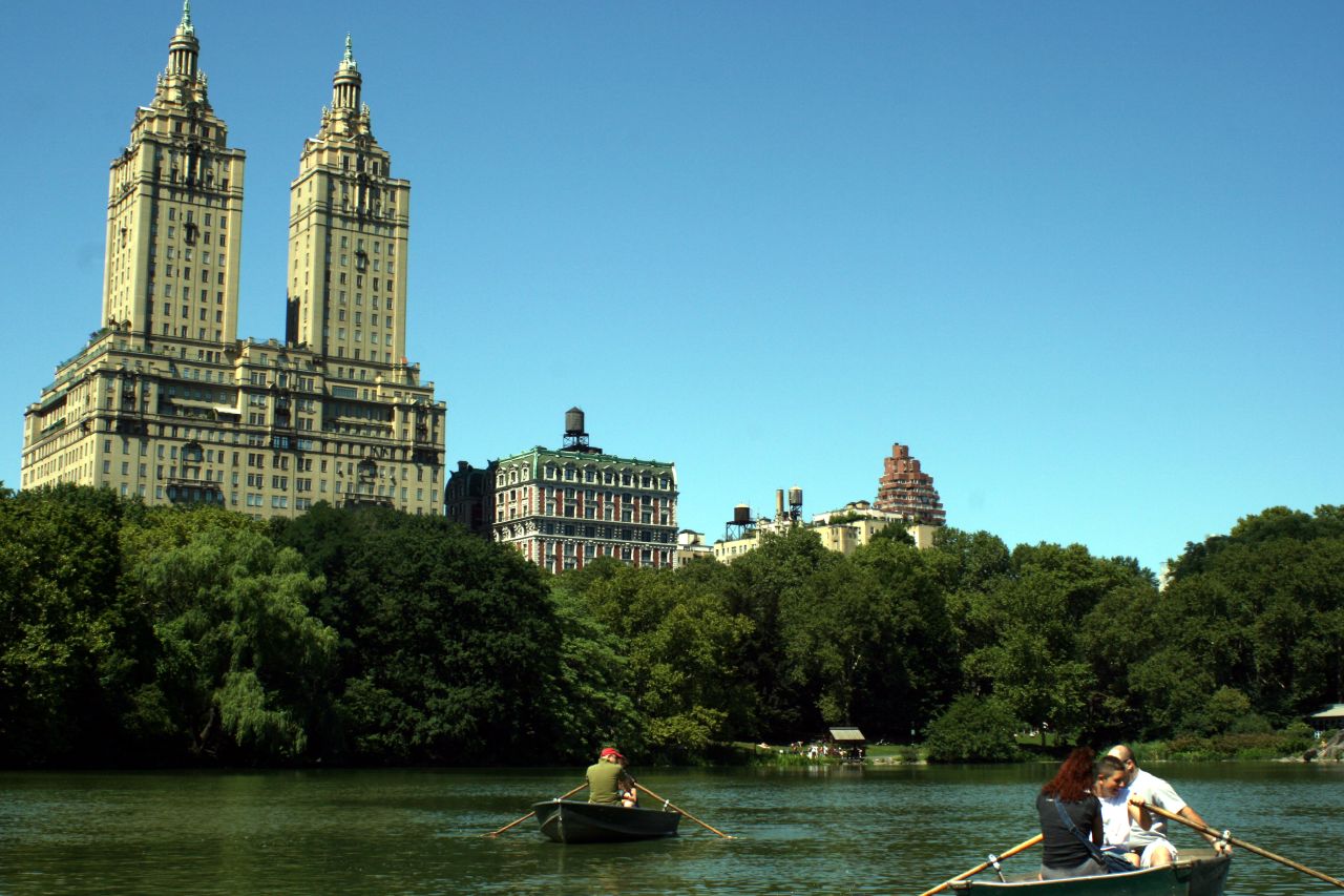 two people on a boat are going down the river