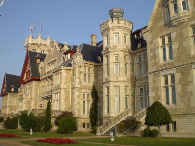 a large castle style building with multiple levels of windows