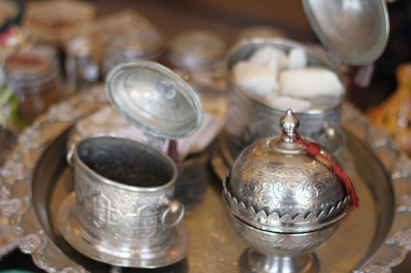 small silver bowls are sitting on a plate