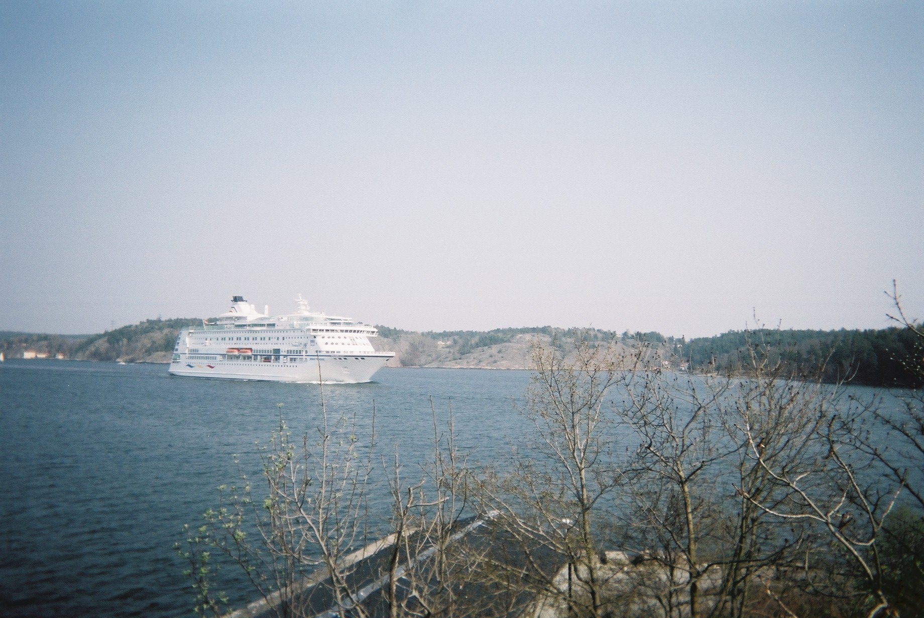 a large cruise ship sitting on top of a river