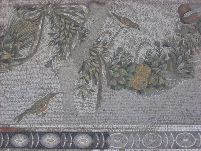 this is a roman mosaic work with birds and flowers
