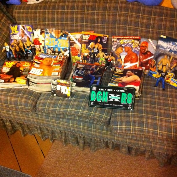 a table with comic books, dvds and figurines