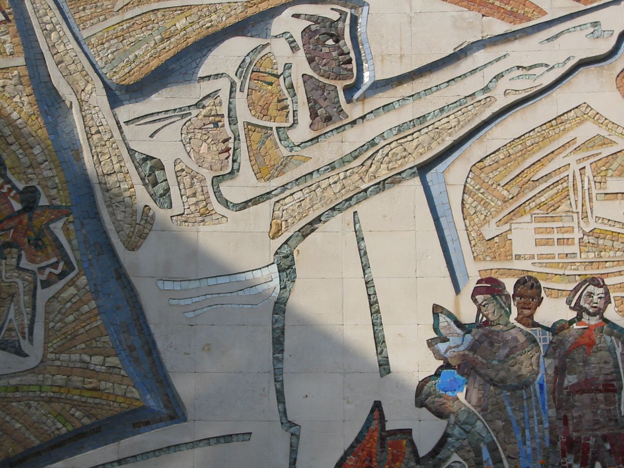 a mural depicting people with weapons standing by each other