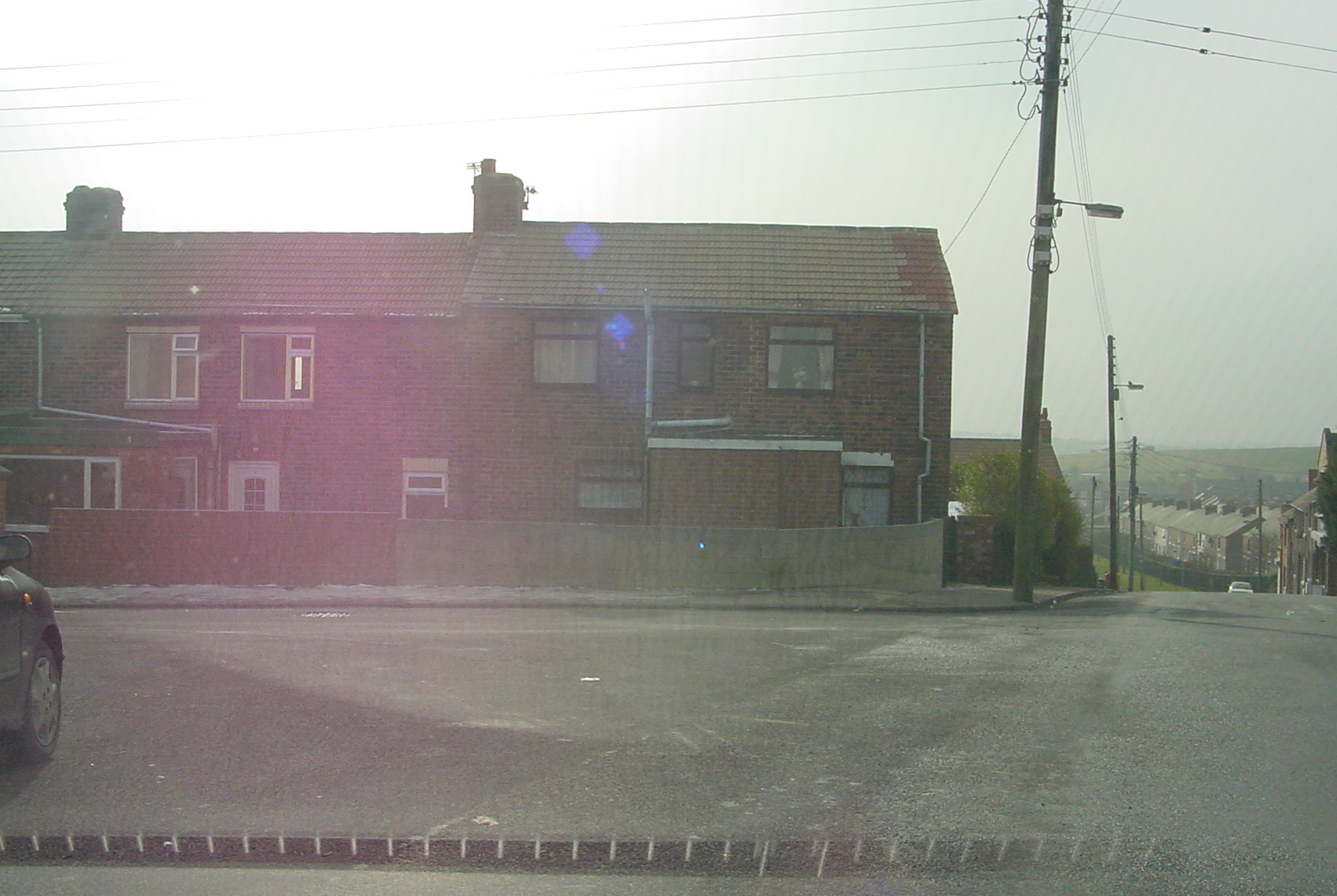 a view of a street from a vehicle window