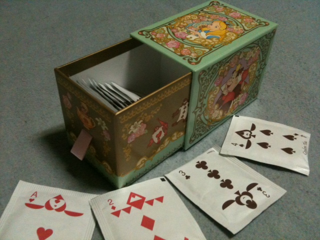 a box sitting on the floor with cards inside