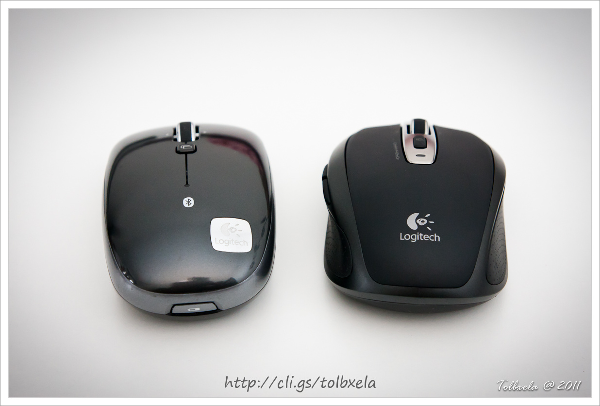 two computer mice one black and the other black and silver