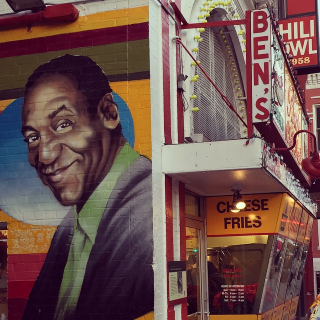 a mural of president obama painted on the side of a building