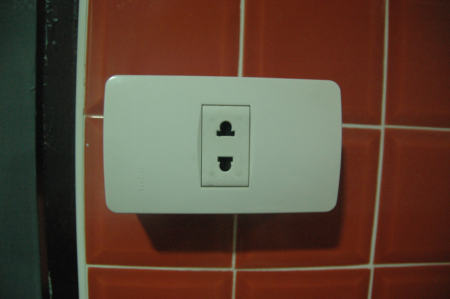 a white electrical outlet attached to a wall