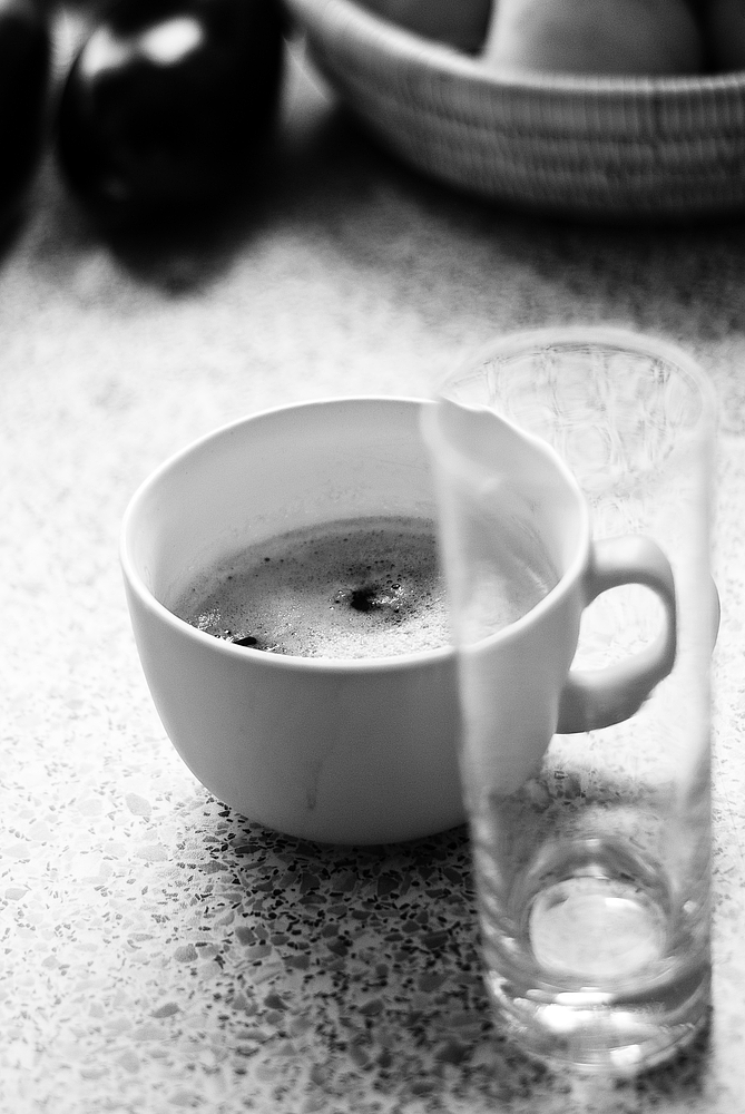 a close up of a cup of coffee on a table