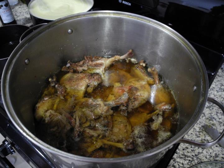 an animal meat in a pan next to a stove