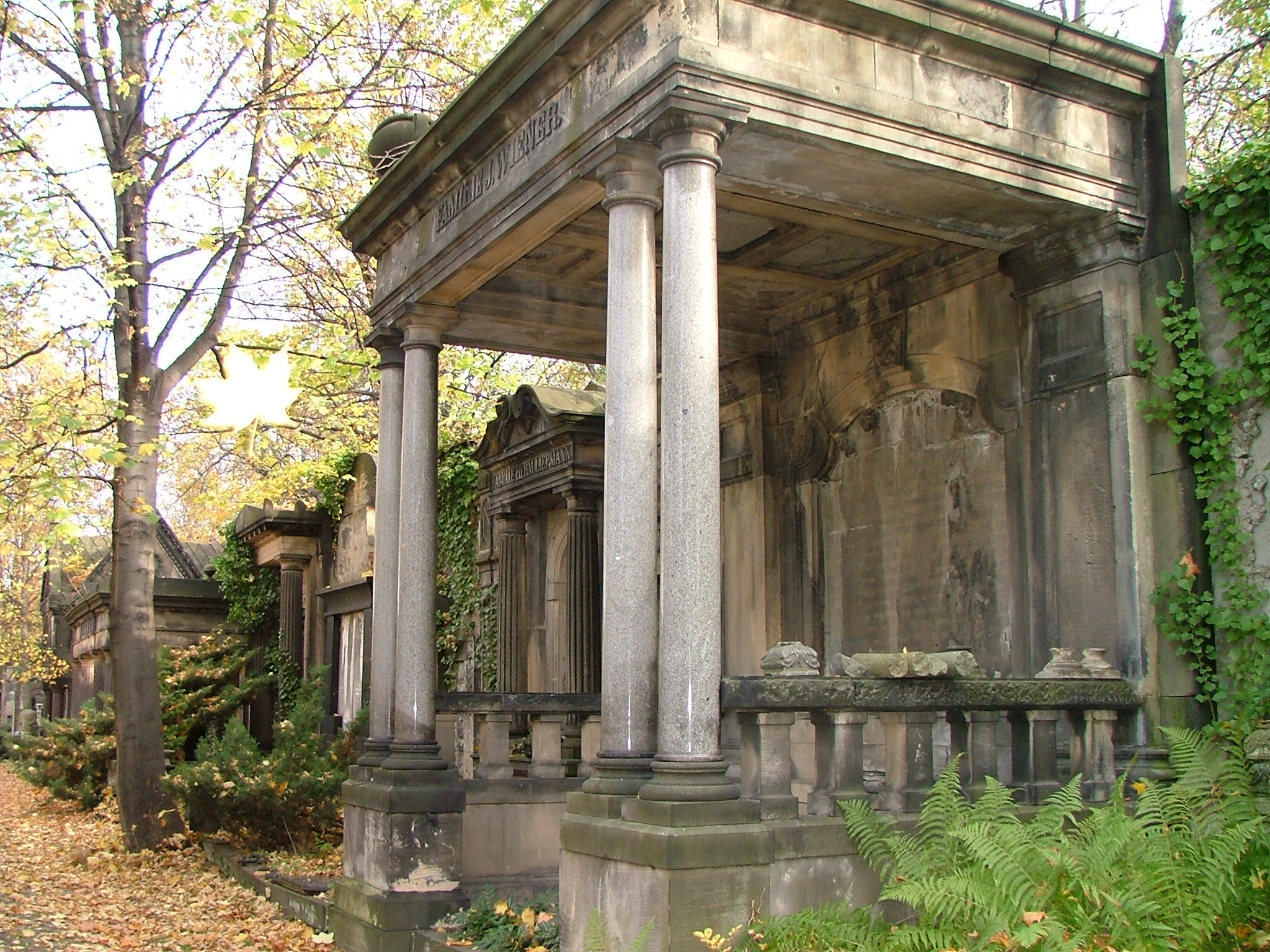 there is a well - worn old building with columns