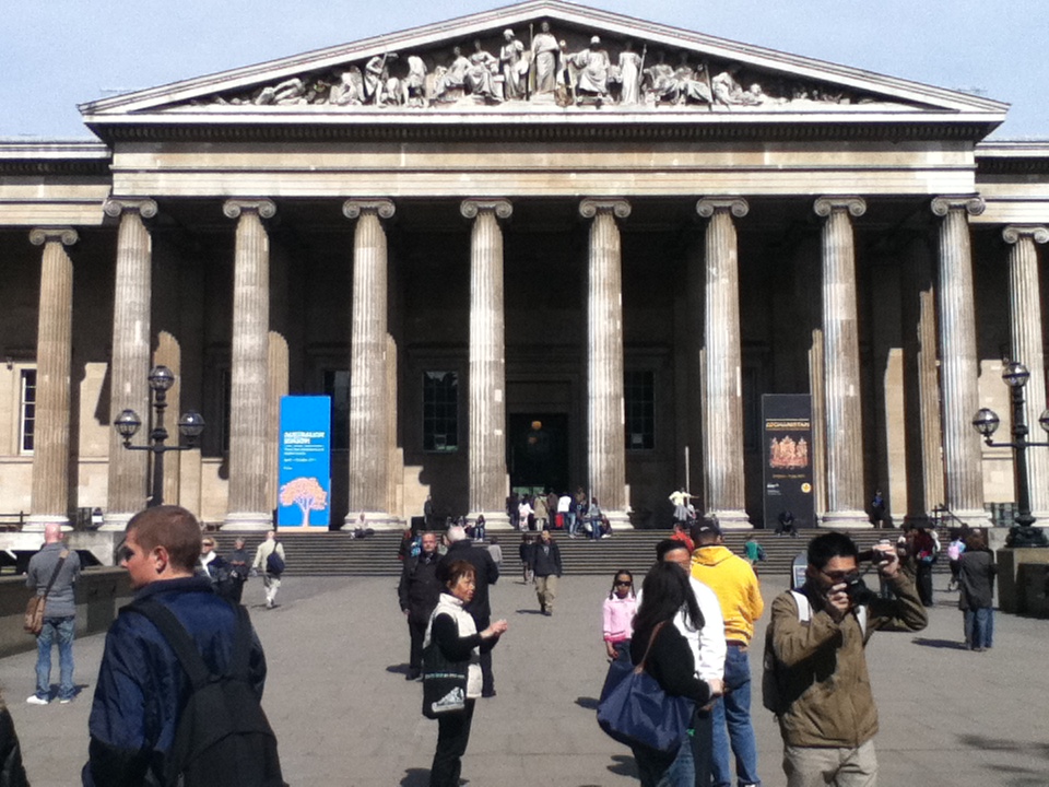 people standing in front of an architectural structure