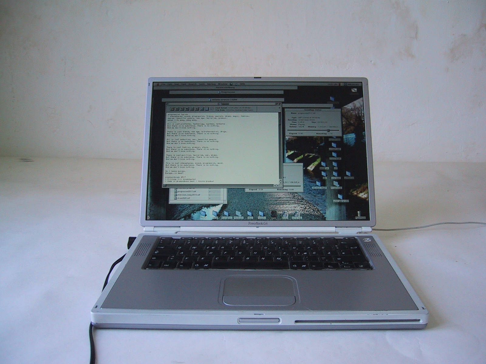 a lap top computer is placed on the bed