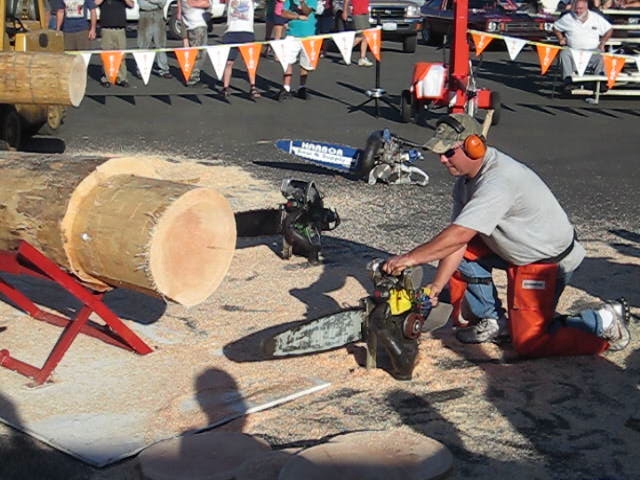 a man is working on a large piece of wood
