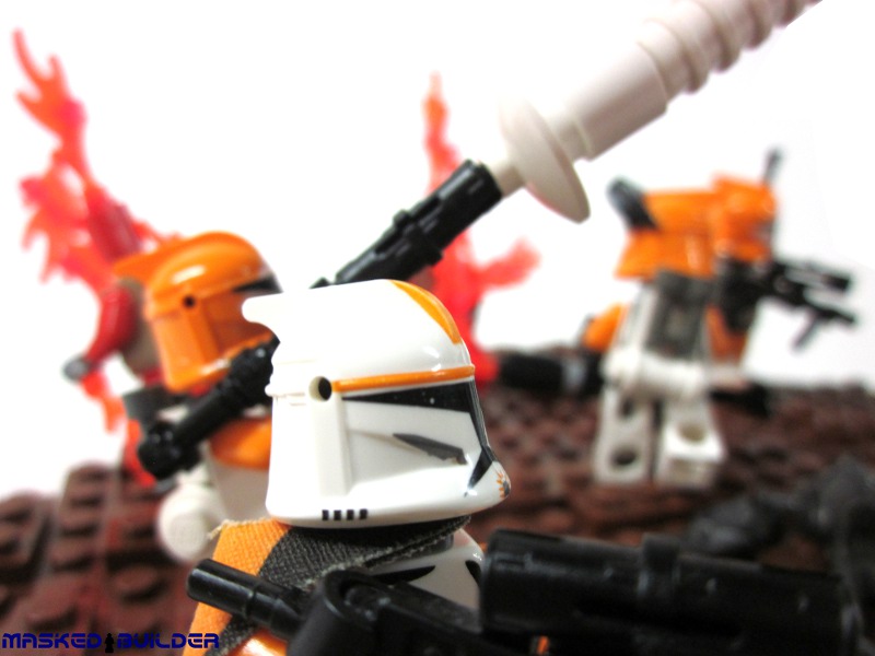 there are many lego stormtroopers playing with each other
