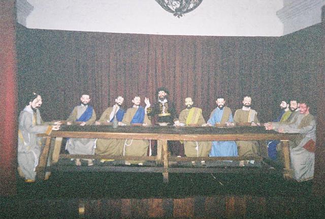 an old po of a group of men sitting around a table