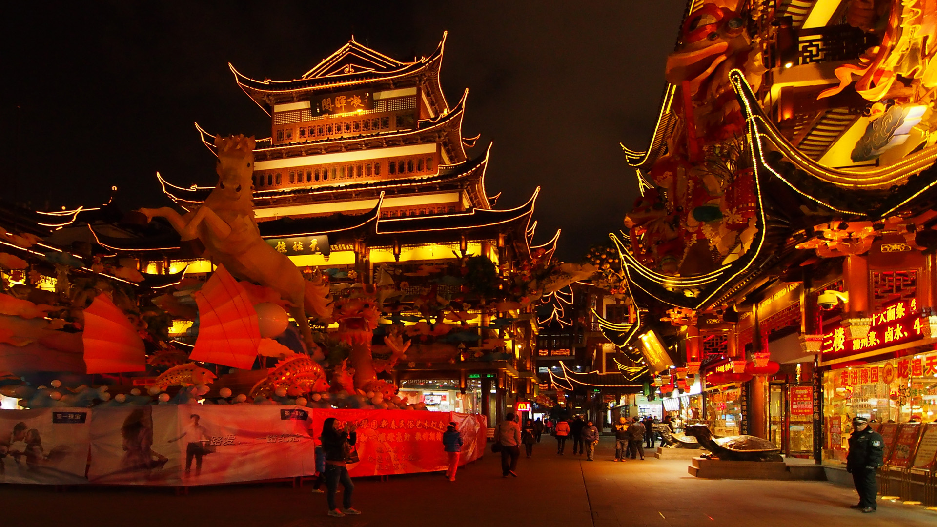 a view of an asian street at night