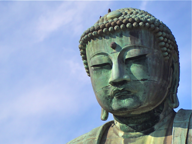 the large buddha statue has eyes and a nose