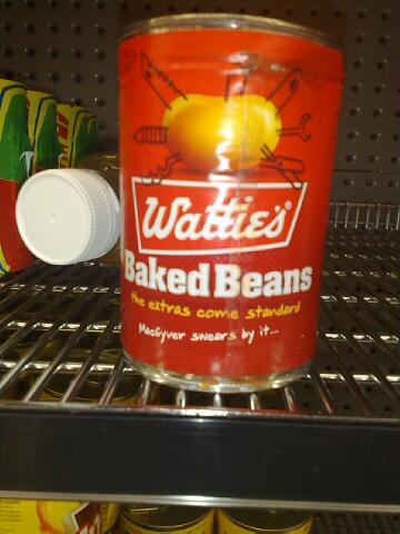 an empty jar of baked beans on the shelf