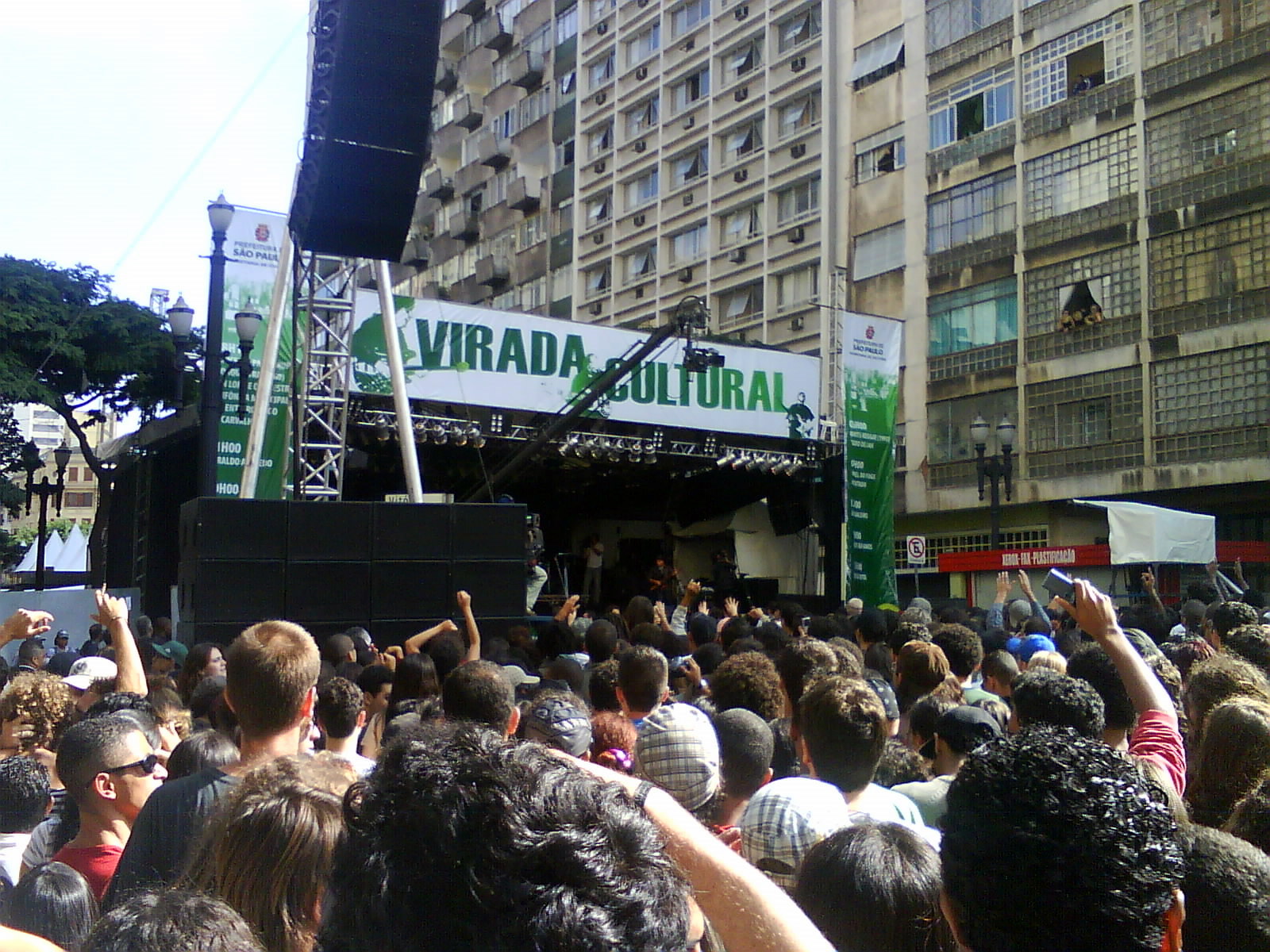 a crowd of people at a concert in the city