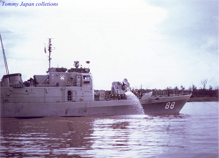 a military boat sailing on a body of water