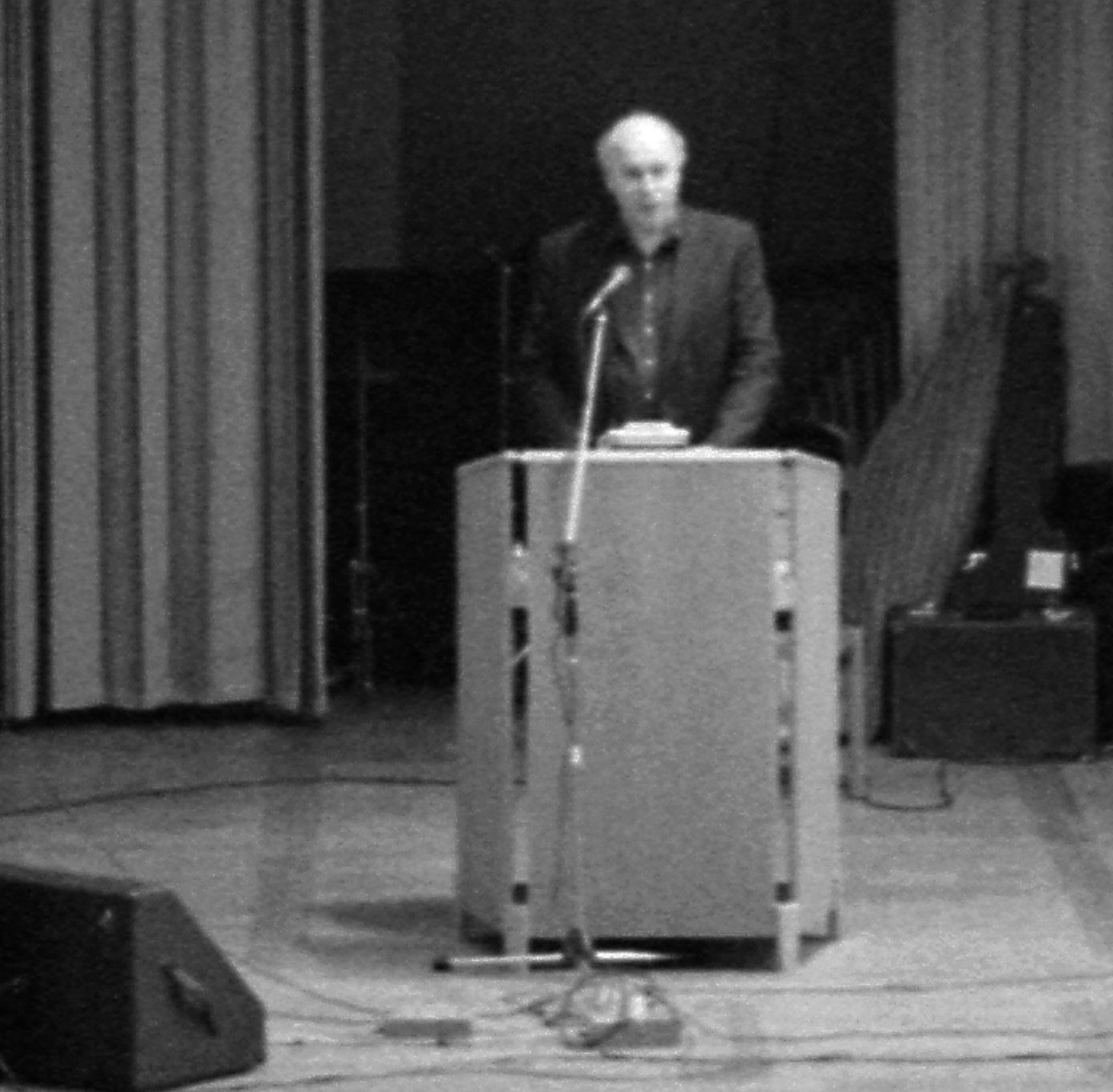 an old po of a man speaking at a podium