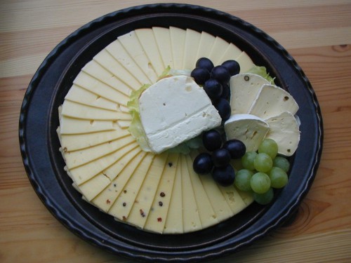 a platter with gs and cheese on it