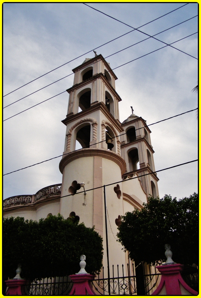 the tall church steeple has clocks on it