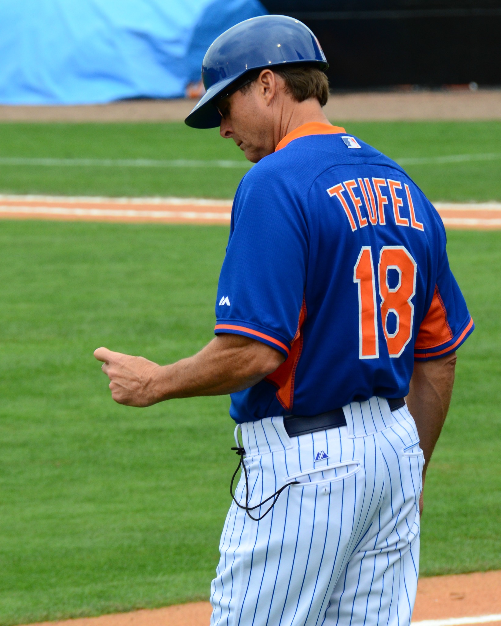 a baseball player with a blue jersey and numbers