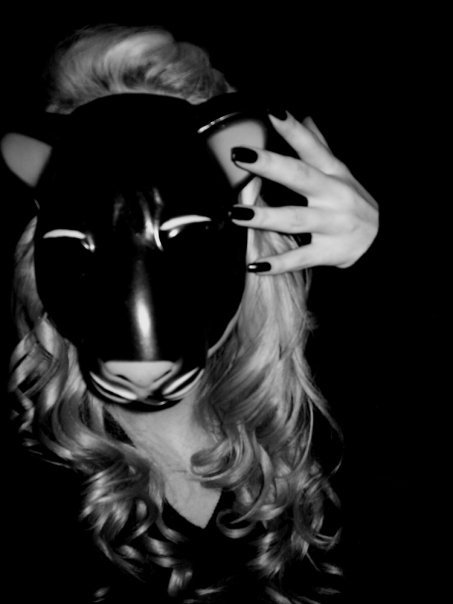 black and white po of a woman with a mask