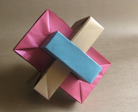 three pink and blue boxes stacked on each other
