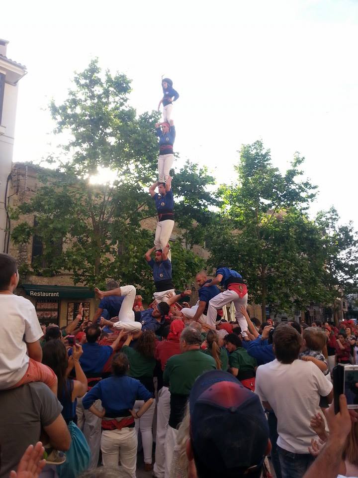 two people are performing a stunt in the air