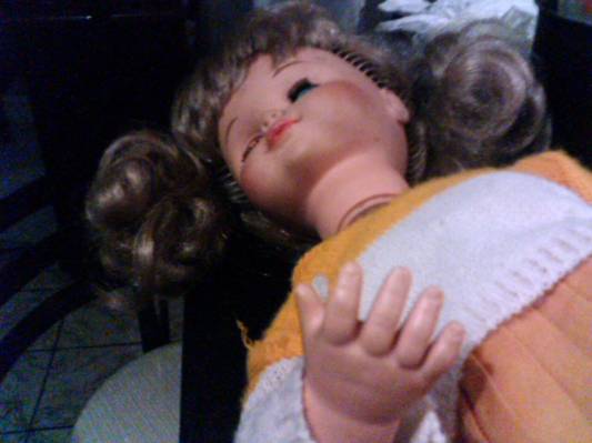 a doll lying on top of another doll