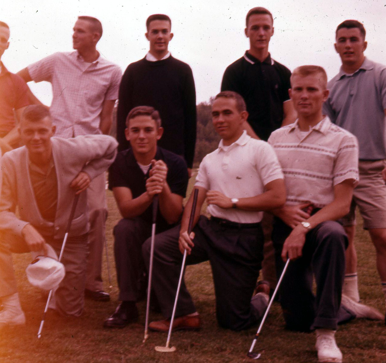 a group of men are posing for a picture