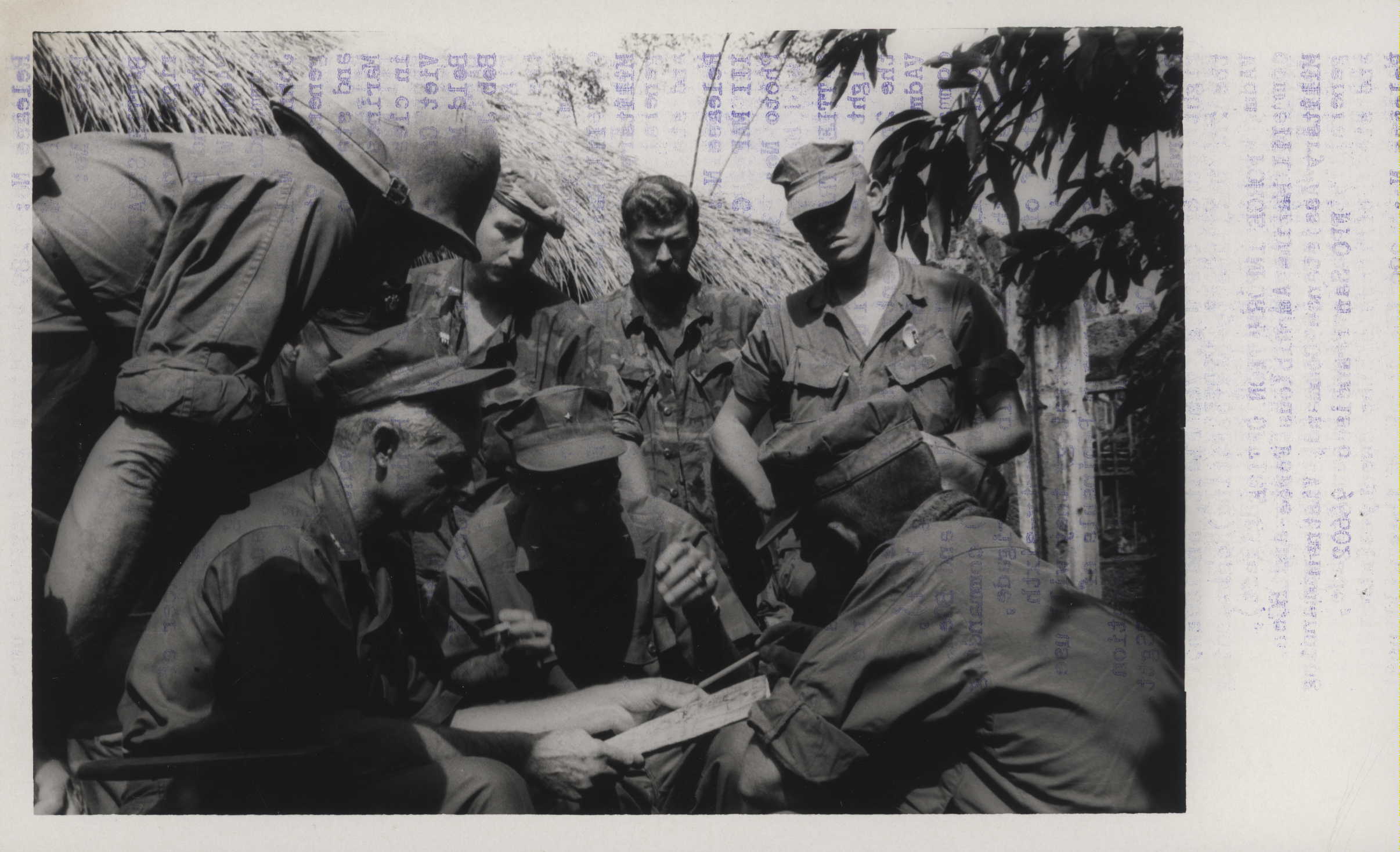 a bunch of men in uniform standing around one another