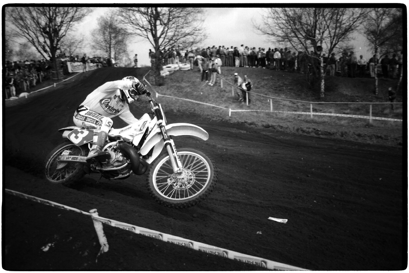 a man is riding a motorbike on the dirt track