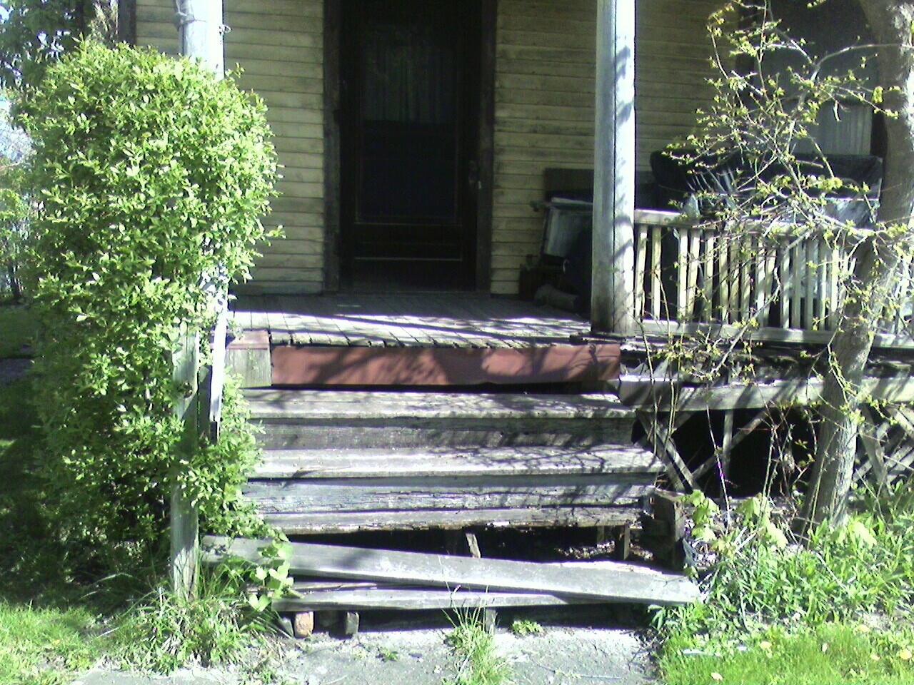 a door and steps leading to a house